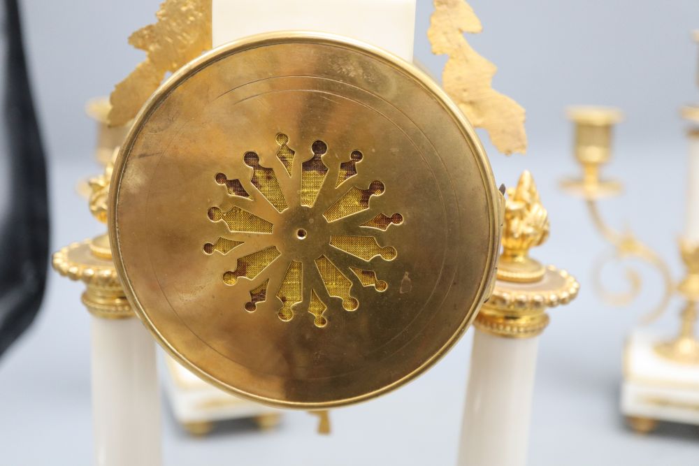 A 19th century French gilt metal and white marble clock garniture, overall height 40.5cm